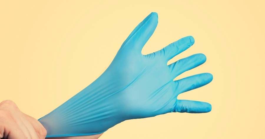putting on a medical glove