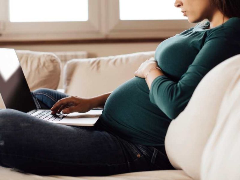 pregnant woman on a laptop