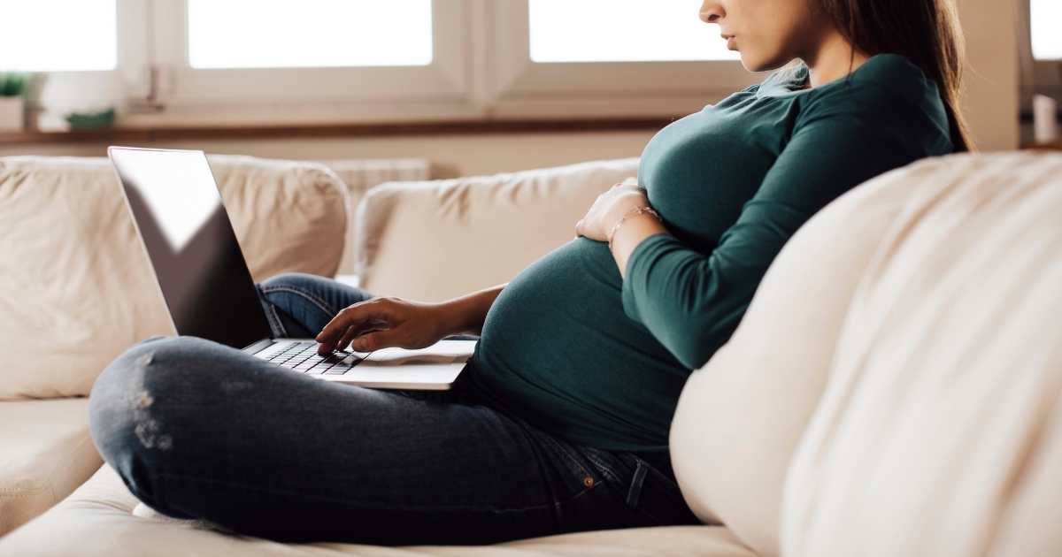 pregnant woman on a laptop