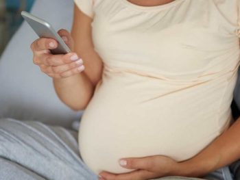 pregnant woman on phone