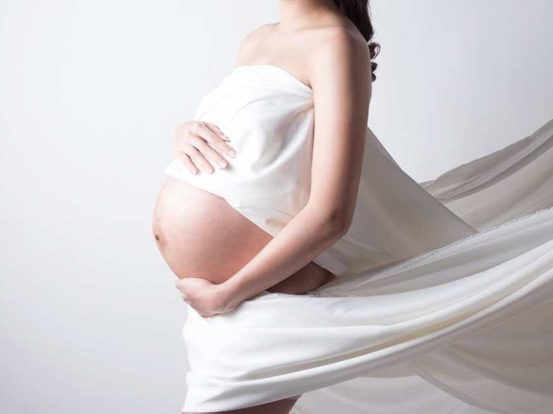 pregnant woman in sheets