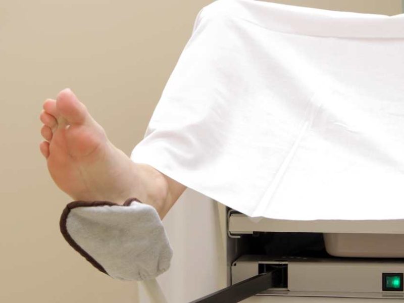 woman in OBGYN stirrups