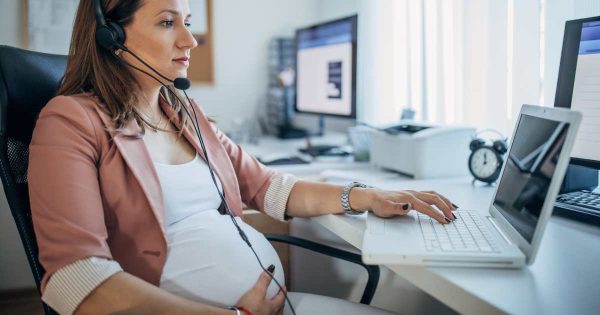 pregnant woman in an office chair