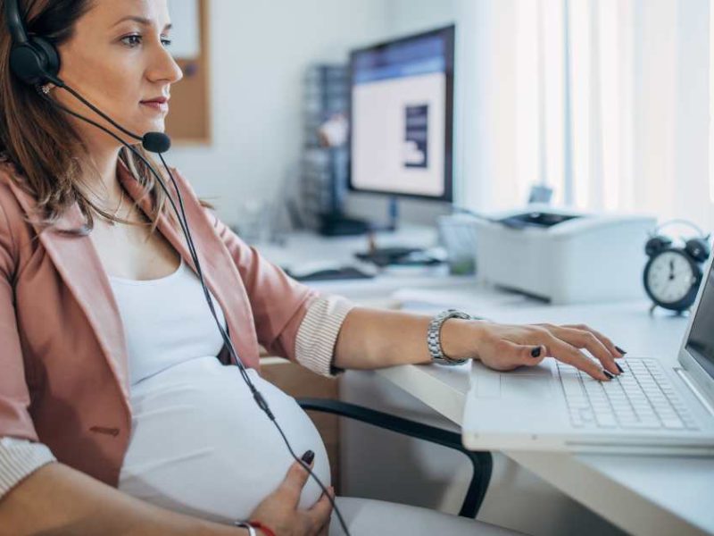 pregnant woman in an office chair
