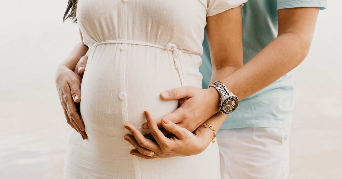 pregnant couple connecting