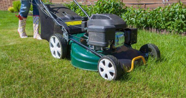 woman mowing the lawn