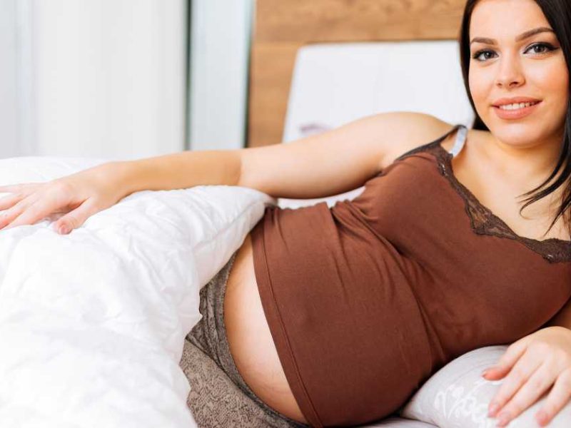 pregnant woman with a weighted blanket