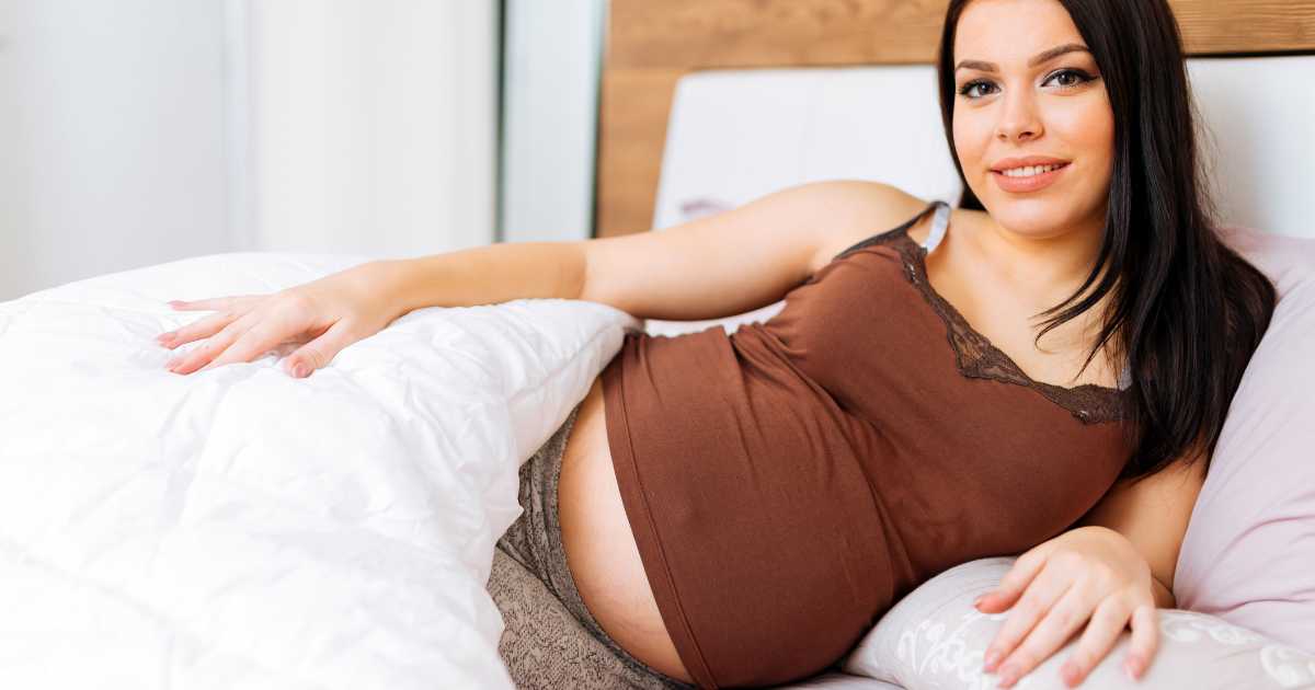 pregnant woman with a weighted blanket