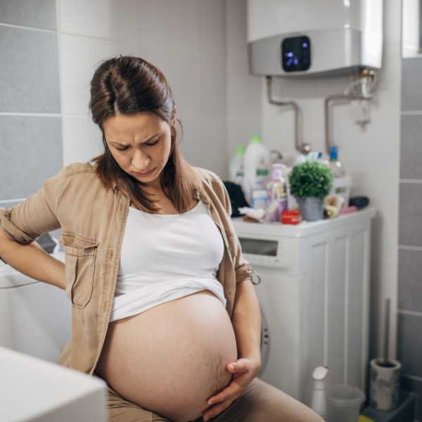 pregnant woman on a toilet