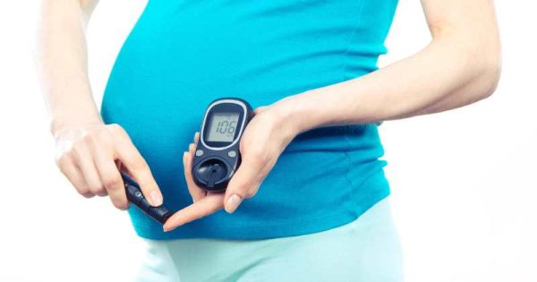 pregnant woman taking a glucose test