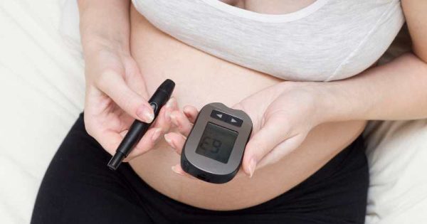 pregnant woman taking a glucose test