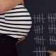 pregnant woman wiht striped shirt, hash marks