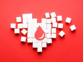 heart made of sugar cubes falling apart, drop of blood.