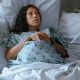 pregnant woman, hospital bed.