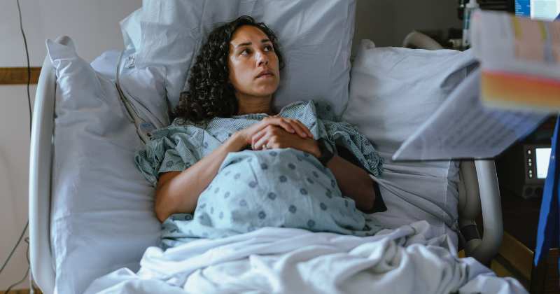 pregnant woman, hospital bed.