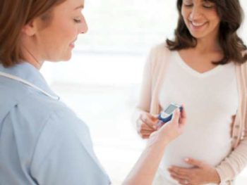 pregnant woman having glucose tested