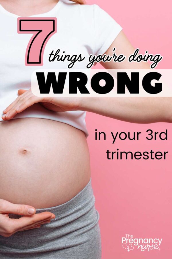 pregnant woman with hands framing belly // 7 things you're doing wrong in your third trimester