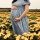 pregnant woman in a field of primrose