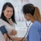 pregnant woman getting her blood pressure checked