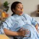 pregnant woman breathing through a contraction at home