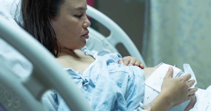 pregnant woman in a hospital bed