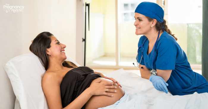 pregnant woman talking to anesthesiologist