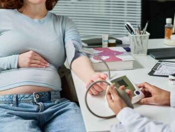 pregnant woman having her blood pressure checked